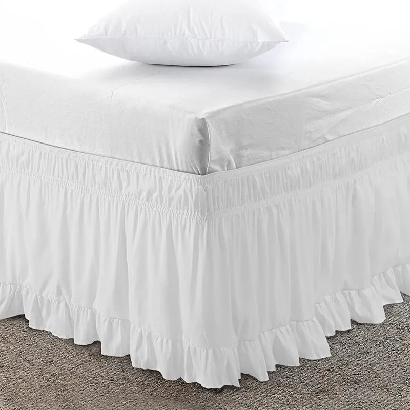White ruffled elastic bed skirt for a queen or king bed