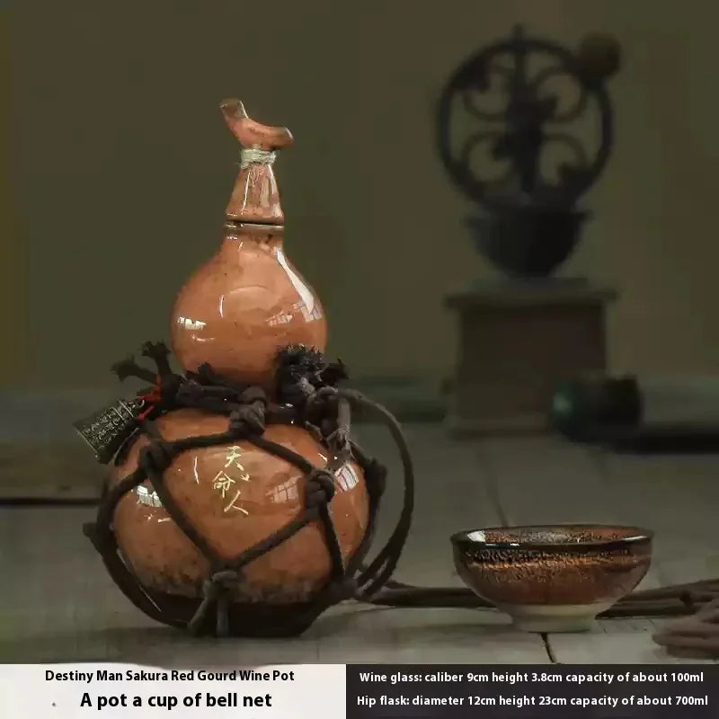 Handcrafted ceramic gourd wine set featuring a pot and a cup of bell net