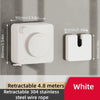White retractable clothesline with a circular mechanism and a rectangular storage piece mounted on a wall.