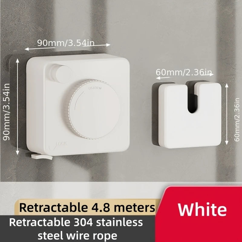 White retractable clothesline with a circular mechanism and a rectangular storage piece mounted on a wall.