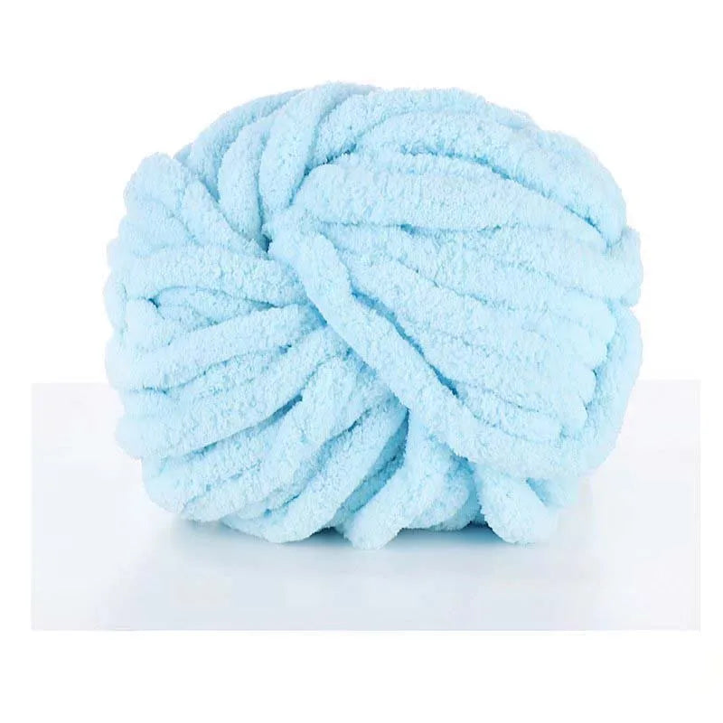 A ball of light blue chunky acrylic yarn for knitting and crochet