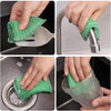 Hands demonstrate the use of green double-sided kitchen scouring sponges for cleaning tasks.