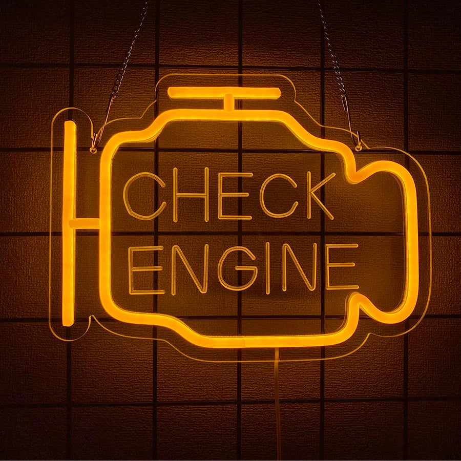 An orange neon sign shaped like an engine with the words CHECK ENGINE glowing on a dark background.