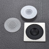 Three circular silicone sink drain filters or strainers are displayed on a dark gray surface.