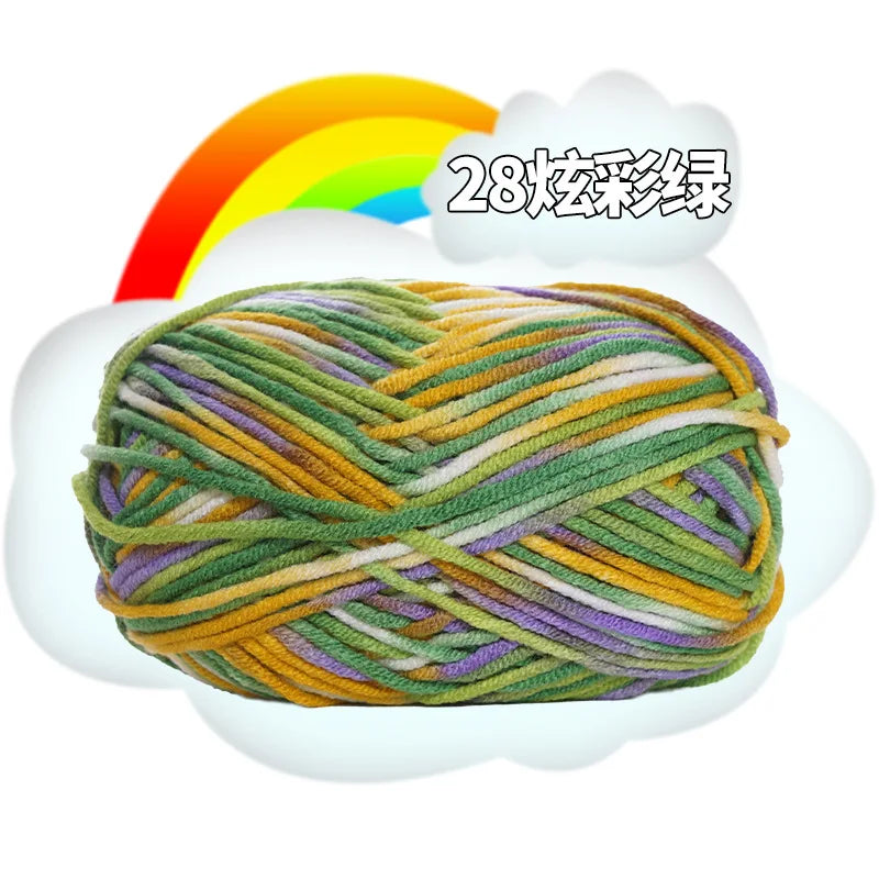 A ball of multi-colored milk cotton blend yarn with a rainbow background.
