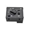 A black electronic switch with various indicator lights and a rotary control for headlights and fog lights.