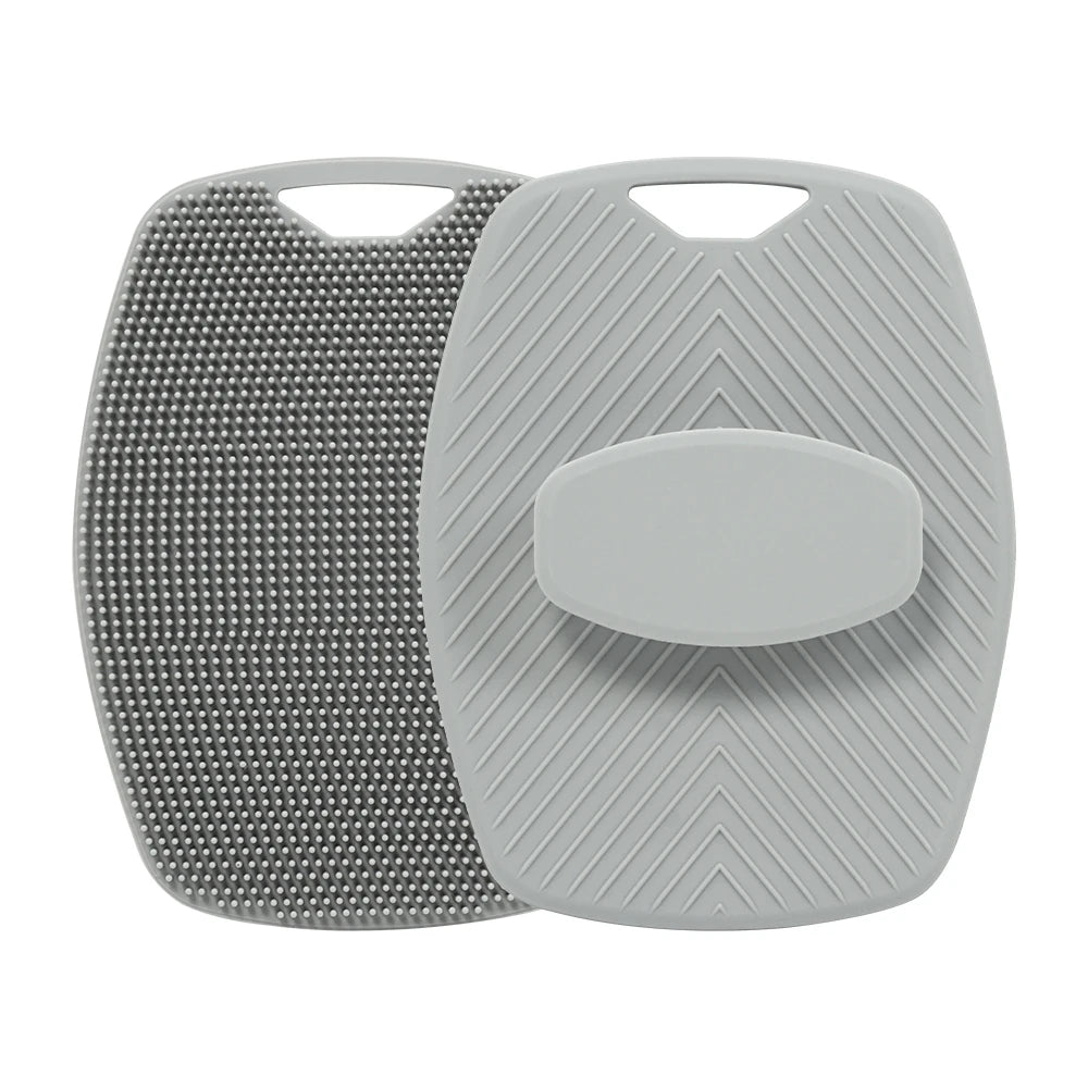 A gray silicone body scrubber and massage brush with textured surfaces.