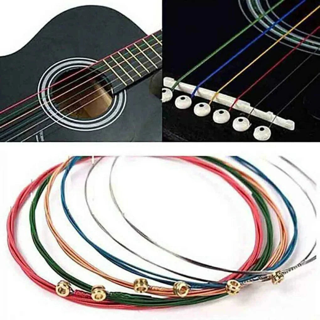 A set of six color-coded acoustic guitar strings, including red, green, blue, and yellow, laid out for display.
