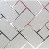 Decorative frosted window privacy film featuring a diamond-patterned design with a silver and rose gold tint.