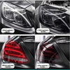 Before and after comparison of smoke black tint film applied to a car's headlight and taillight.