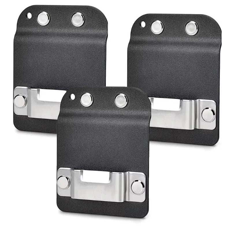 Three black clip-on tool belt holsters for drills and power tools shown from above.