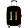 Black rolling suitcase with a gold letter H print on the side.