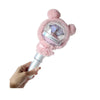 A hand holds a plush pink cover for a SEVENTEEN official light stick, featuring a clear dome design.