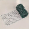 A roll of green PVC-coated hexagonal garden fencing netting laid out next to a flat piece of the same material.