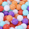 A large collection of colorful plastic balls in various shades including orange, pink, purple, and blue.