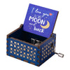 A wooden music box with a lid featuring the text I love you to the moon and back