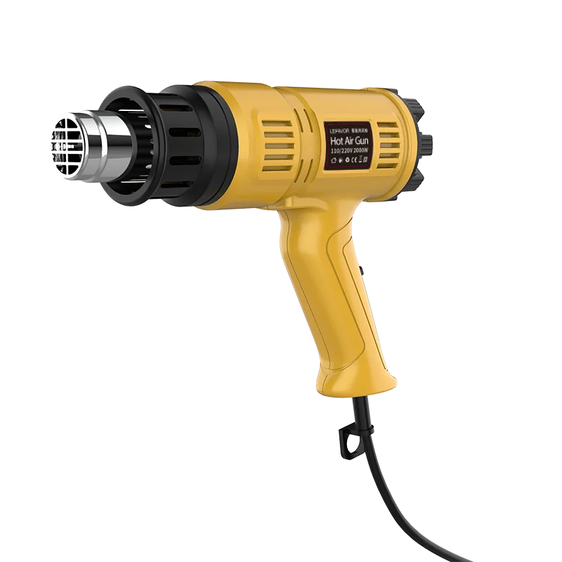 Yellow heat gun with a detachable nozzle and cord against a black background.