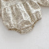 A light beige floral print baby girl romper with gathered fabric details.