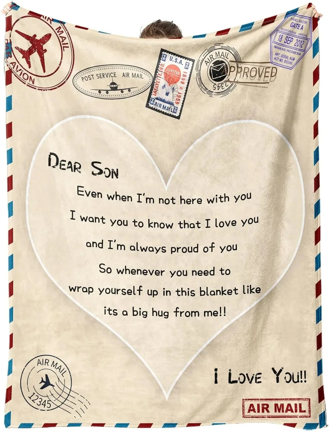A beige fleece throw blanket with a heart design and text saying Dear Son I love you and I'm always proud of you
