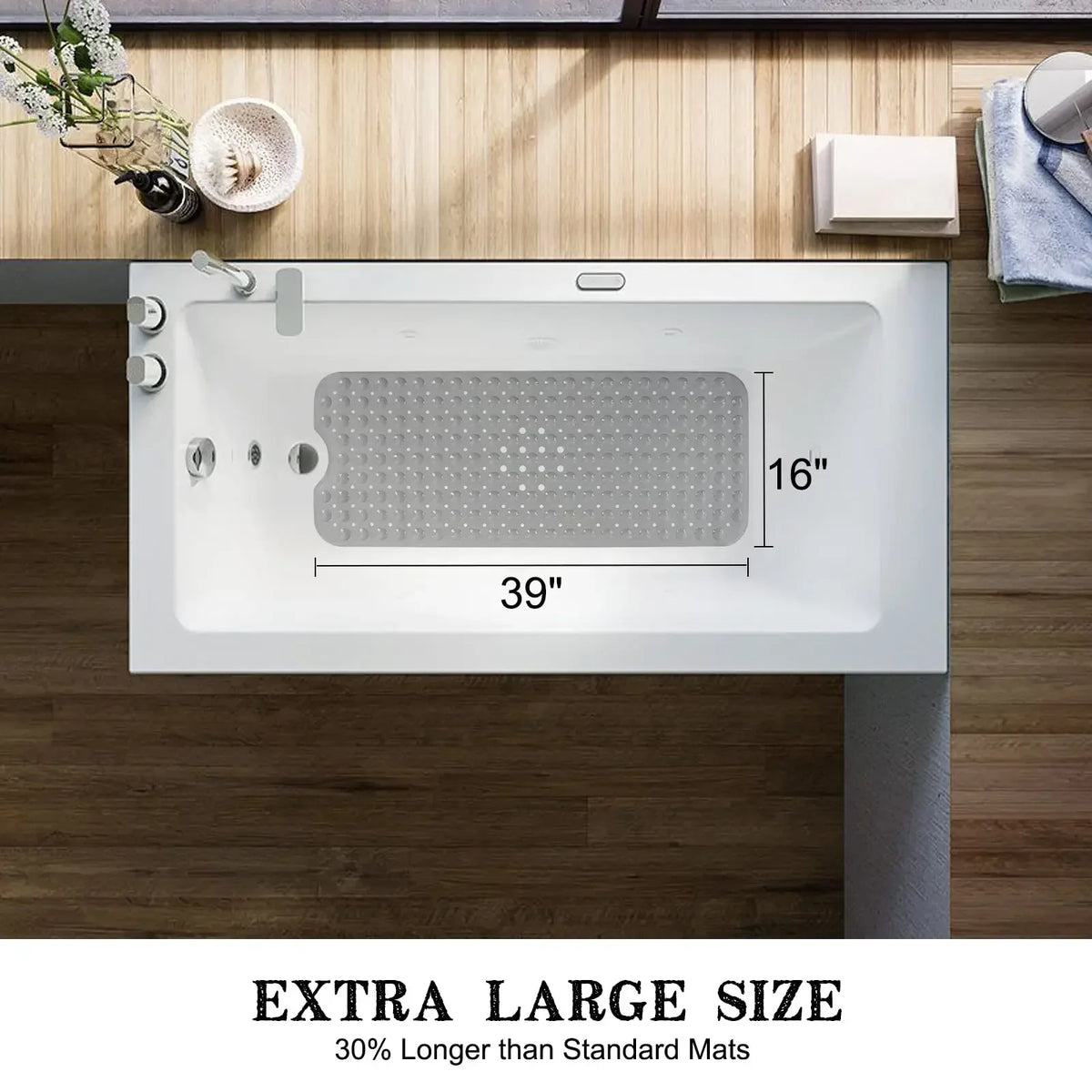 A white bathtub mat with suction cups and drain holes is shown on a wooden countertop.