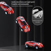 Red and black die-cast pull-back sports car model with accessories shown against a dark background.