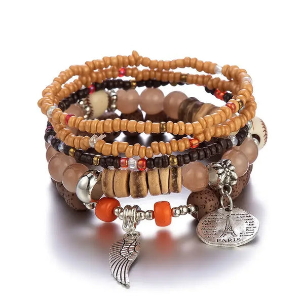 A set of stacked beaded bracelets featuring natural stone beads and silver accents.
