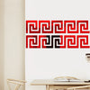 Red and black geometric maze pattern wall stickers on a white wall.