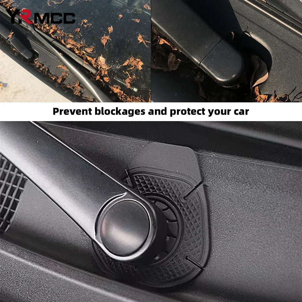 Close-up of a black windshield wiper hole protective cover installed on a car, preventing blockages.