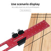 A red aluminum pocket ruler with a T-track slide stop is shown measuring wood grain.