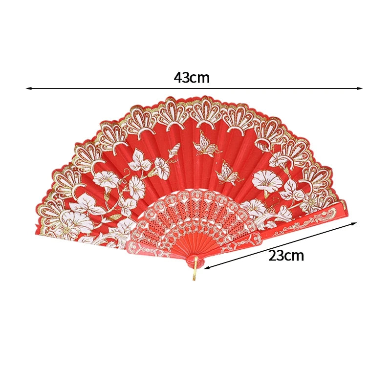 Red folding fan with white lace trim and golden edge, shown flat.