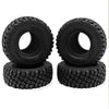 A pair of black rubber mud terrain tires for Axial SCX24 and TRX4M trucks.