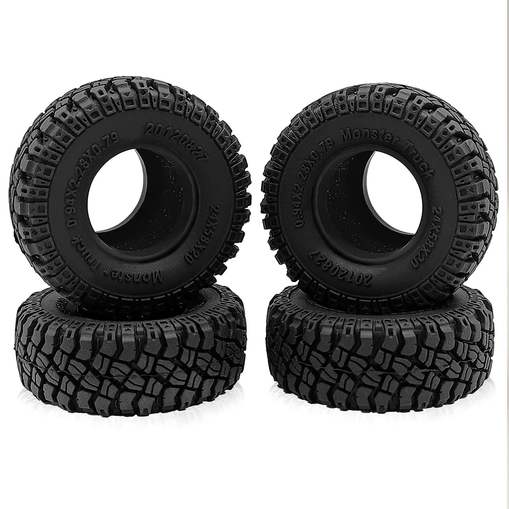 A pair of black rubber mud terrain tires for Axial SCX24 and TRX4M trucks.