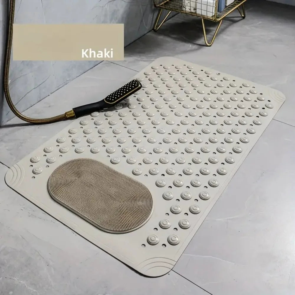 A beige non-slip suction cup bath mat with massage nodes placed on a light gray floor.