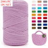 A skein of thick purple yarn is shown next to a crocheted bag.
