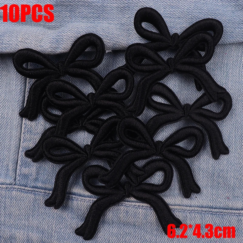 Ten black embroidered cartoon bow iron-on patches for DIY clothing decoration