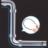 A flexible drain auger with a claw grabber is shown being used to clear a drain pipe.
