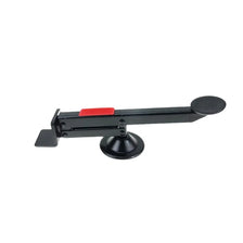 A black and red heavy-duty steel tool used for installing a door lift, featuring a rotating mechanism.