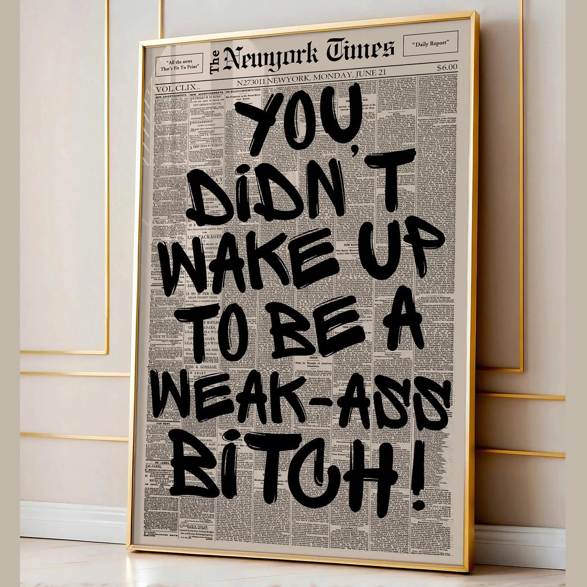 A framed print featuring a large black text quote on a vintage newspaper background.