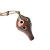 Handcrafted ceramic pendant ocarina featuring six holes, suspended by a cord.