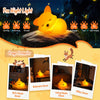 An orange squishy fox night light resting on a dark surface, highlighting various features like dimmable and rechargeable bat
