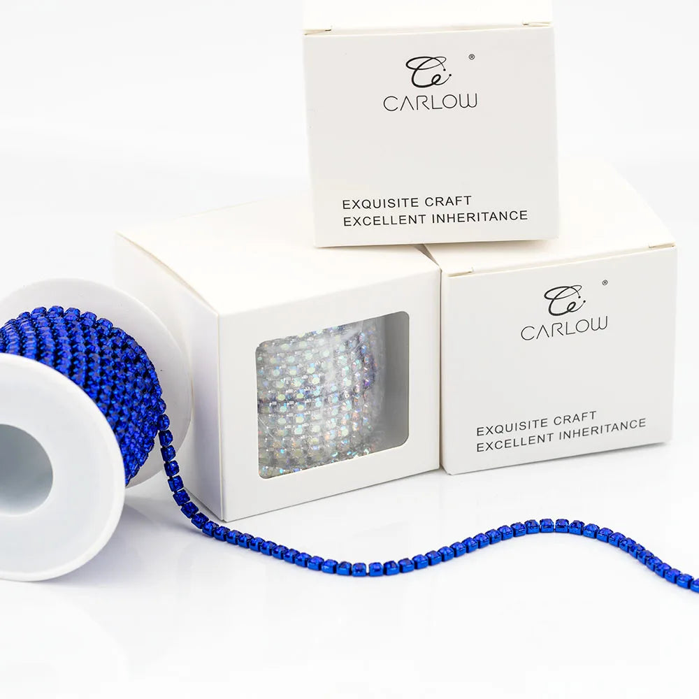 A box of Carlow exquisite craft excellent inheritance with a blue glass rhinestone chain displayed next to the packaging.