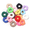 A collection of colorful acrylic spacer beads in various shapes and colors for jewelry making