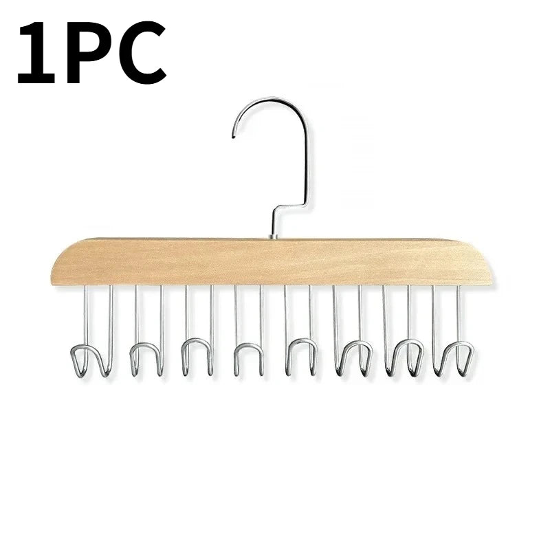 A wooden hanging clothes rack with multiple metal hooks for hanging clothes.