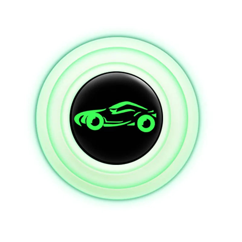 A round silicone pad with a black center and a green silhouette of a car inside.