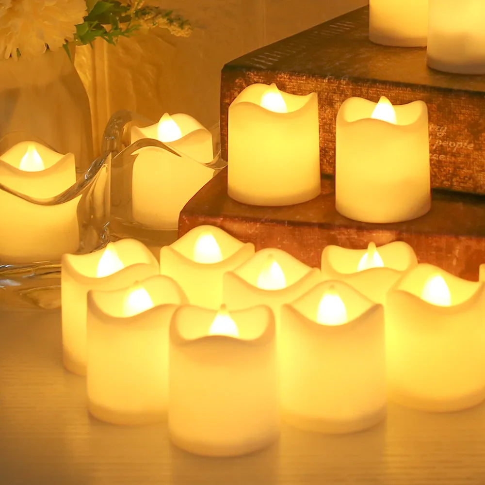 A close-up of multiple glowing white LED tea lights arranged on a wooden surface, set against a warm, soft background.