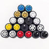 A collection of 10 pairs of 1:64 scale alloy car wheels and tires in various colors including blue, yellow, silver, and red.