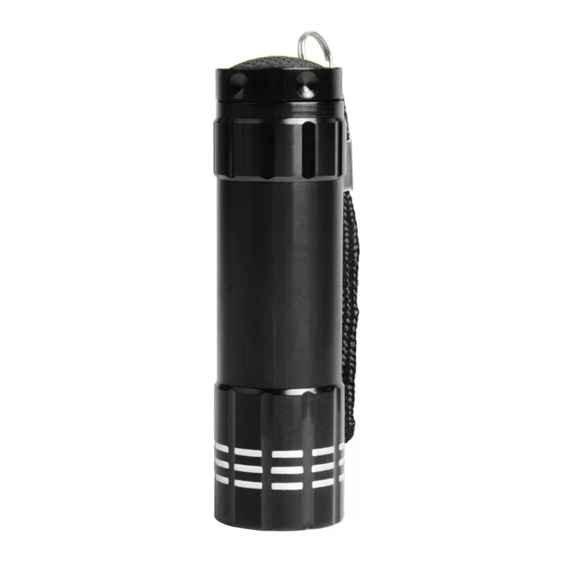 A black rechargeable UV flashlight with a cylindrical body and a textured grip.