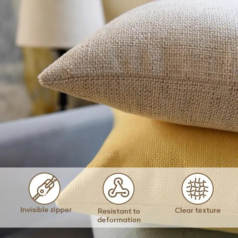 Close-up of a beige linen cushion cover showing features like an invisible zipper, resistance to deformation, and clear textu