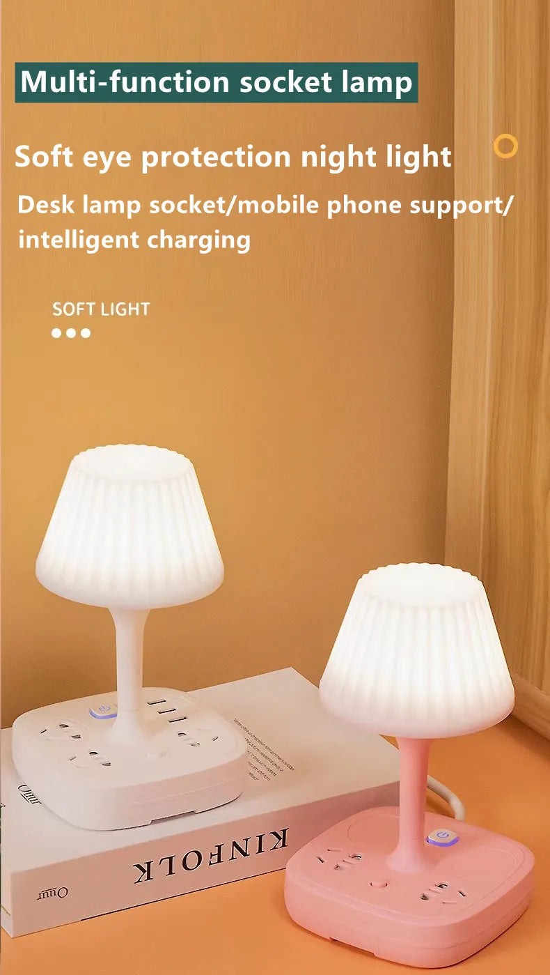 A white multi-function socket lamp with a shade sits on a wooden desk next to a pink charging base.