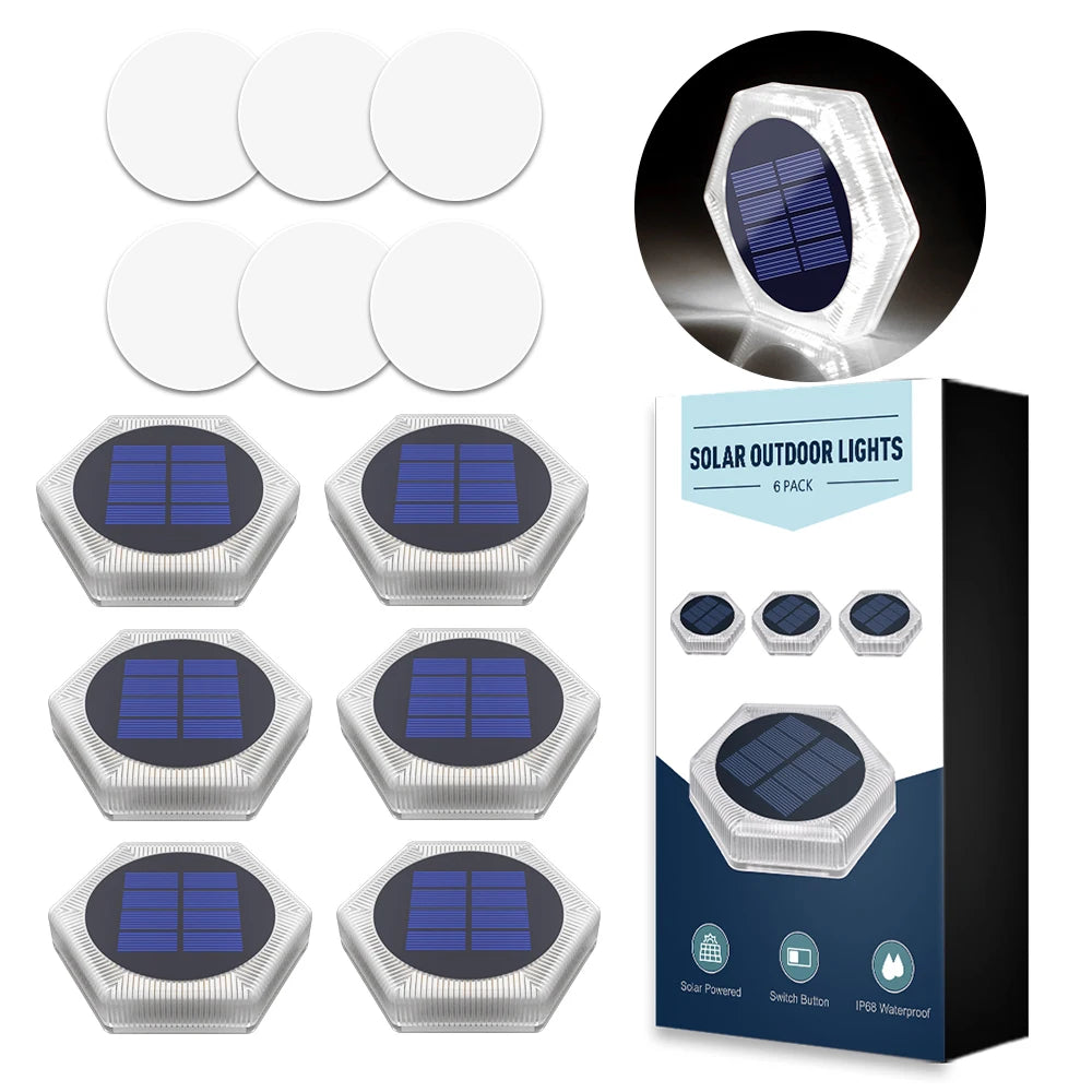 A set of solar powered LED outdoor lights in various sizes and angles, packaged in a box.